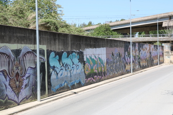 Pintar el muro del paseo de Can Donadéu (riera Seca)